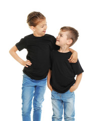 Wall Mural - Little kids in t-shirts on white background. Mockup for design