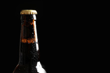 Bottle Of Tasty Cold Beer On Black Background, Closeup