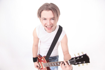 portrait in full growth.a young guy with a guitar