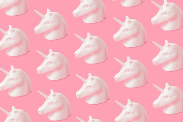Wall Mural - creative unicorn pattern on pink background. abstract art background. minimal fantasy concept.