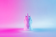 White Painted Unicorn Head In Bold Pink And Blue Neon Colors On Gradient Background. Minimal Art Fantasy Concept.