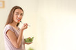 © Pixel-Shot - Young pregnant woman eating healthy salad at home