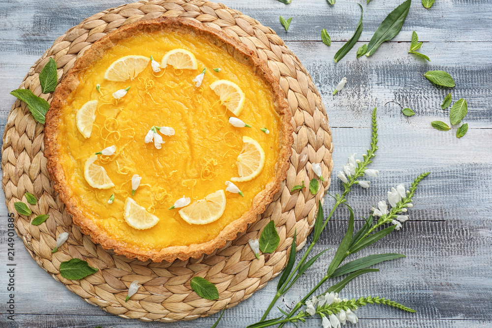 Delicious lemon pie on wooden table