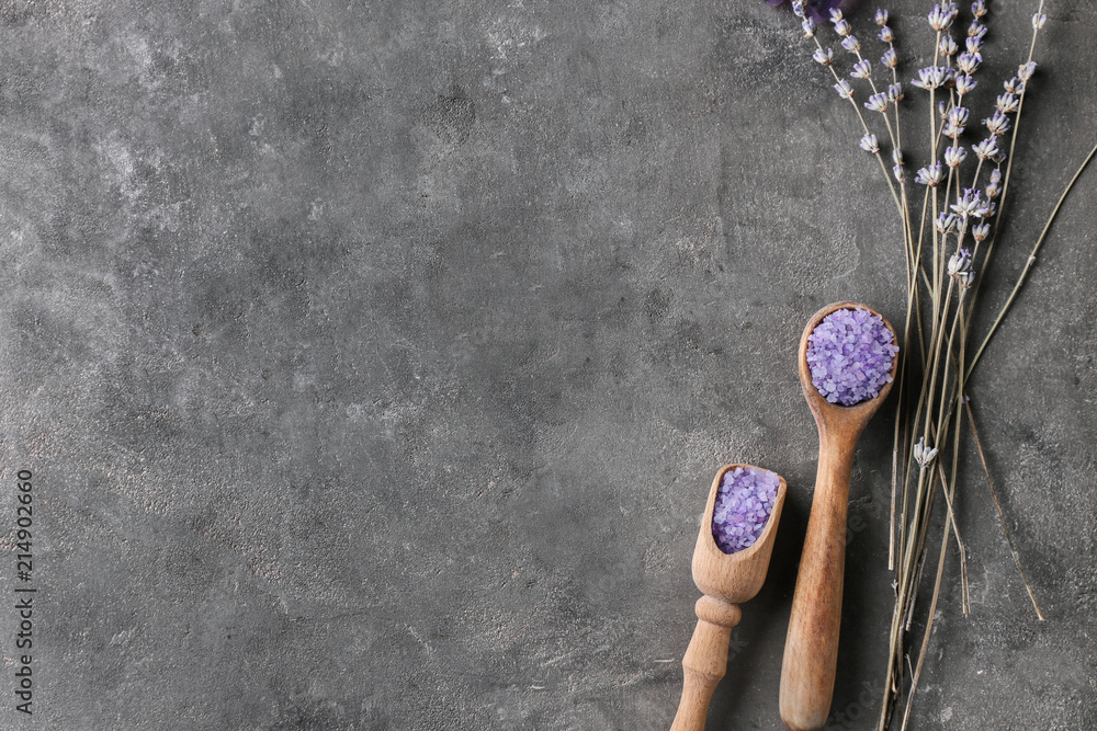 Sea salt for spa and beautiful lavender on dark table