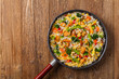 © gkrphoto - Nasi goreng. Fried rice with egg and vegetables.