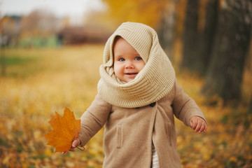 cute happy girl in autumn park