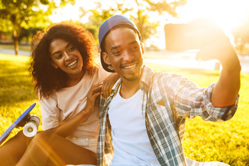 Wall Mural - Portrait of a smiling young african couple