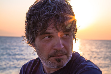 Handsome middle aged man close-up portrait / Sunset portrait