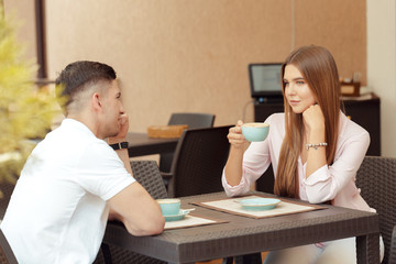 Wall Mural - Two people in cafe enjoying the time spending with each other