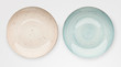 Empty pink ceramic plates isolated