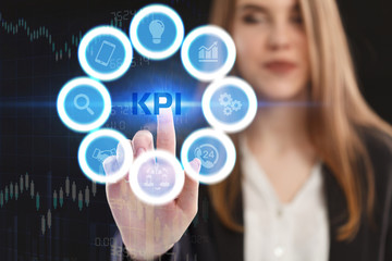 The concept of business, technology, the Internet and the network. A young entrepreneur working on a virtual screen of the future and sees the inscription: KPI