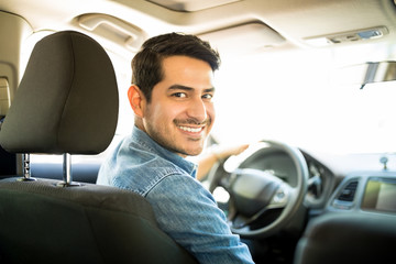 Good looking guy driving car