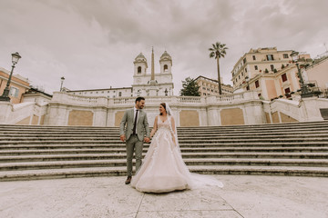 Wall Mural - Young wedding couple on Spanish stairs in Rome