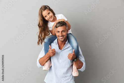 Portrait of adorable family, daughter smiling and sitting on the neck of her fat Poster Mural XXL