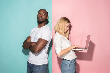 Wall Mural - Businesswoman hugging laptop. Love to computer concept. Attractive female half-length front portrait