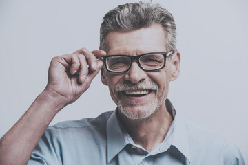 Adult Smiling Man with Glasses.