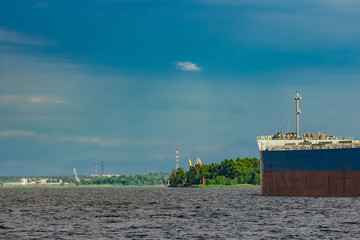 Wall Mural - Blue cargo ship underway