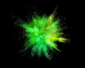 Wall Mural - Coloured powder explosion isolated on black background