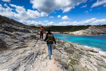 exploring the beautiful shorelines in mallorca under a gorgeous cloudy sky.
