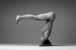 © Alexander Y - Young beautiful yoga woman is posing in studio. Black and white