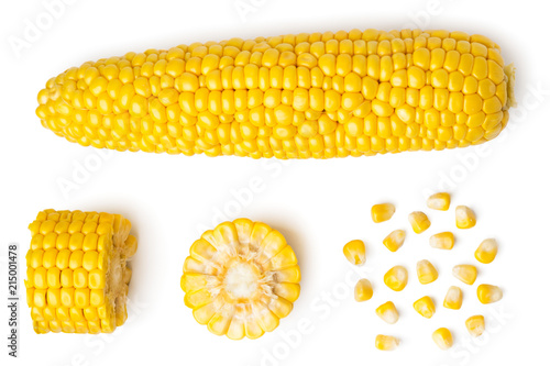 Fotografía The peeled ear of corn, a piece of and seeds on a white, isolated