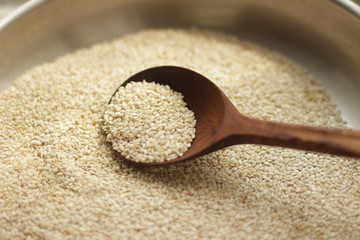 sesame seeds in a wooden spoon