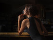 © Restyler - elegant lady in black dress, in restaurant at a bar