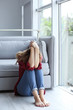 © New Africa - Lonely woman suffering from depression at home