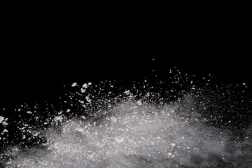 Wall Mural - Launched white powder, isolated on black background.