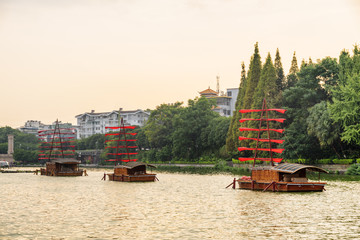 Poster - Wooden ships decorated with red flags in Guilin, China