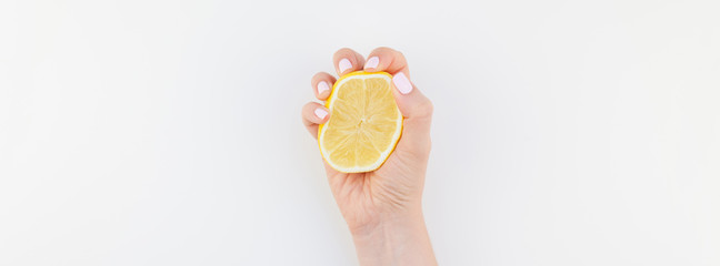 Woman hand with lemon