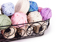 Black Metal Basket Filled With Romanian Point Lace Macrame Crochet Cords In Various Colors To Be Used Make Tablecloth And Doily Craft Projects.