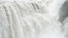 Iceland Dettifoss Waterfall Largest Greatest Volume In Europe Closeup, Gray Grey Water, Rocky Cliff And Water Flowing
