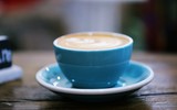 Fototapeta Mapy - Latte coffee closeup blur background