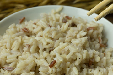 Canvas Print - A Cooked  Jasmine Rice , Brown Rice in bowl  on wood table.