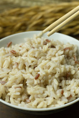 Canvas Print - A Cooked  Jasmine Rice , Brown Rice in bowl  on wood table.