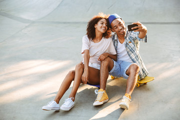 Wall Mural - Portrait of a smiling young african couple