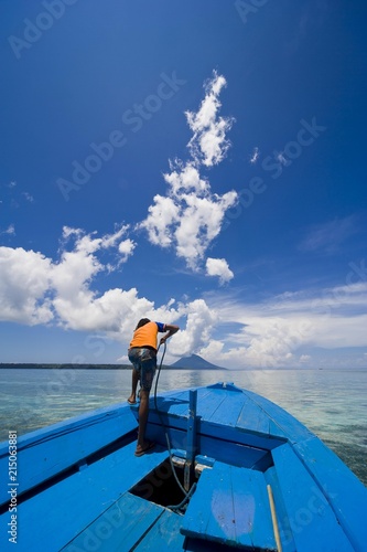 Ship Boy Hauling In The Anchor Siladen National Park Sulawesi Ship Boy Hauling In The Anchor Siladen National Park Sulawesi Indonesia Southeast Asia