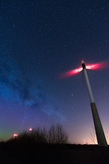 Wall Mural - beautifl night starry sky with milky way galaxy, win turbines and aurora borealis.