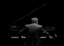 Pianist From His Back Playing In The Dark