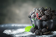 Ripe blackberry on a wooden table. Dark background.
