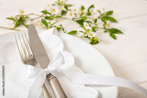 Fotografía Holiday table place setting with plates, fork and knife