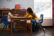 © Kinzie+Riehm - Students  in a classroom at a Montessori school.