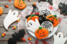 Halloween Gingerbread Cookies In Plate On Wooden Table