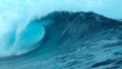 © helivideo - CLOSE UP: Picturesque tube wave crashes wildly and splashes ocean water in air.