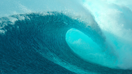 Wall Mural - CLOSE UP: Big tube wave crashes on the sunny coast of a remote tropical island.