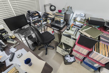 Cluttered Messy Business Office With Full File Boxes And Notebooks.