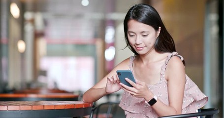 Sticker - Woman use of smart phone for sending sms at outdoor coffee shop