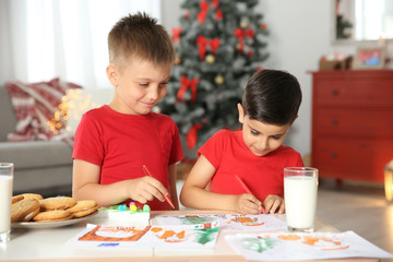 Wall Mural - Little children drawing picture at home. Christmas celebration