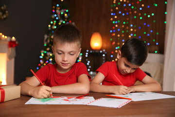 Canvas Print - Little children drawing pictures at home. Christmas celebration